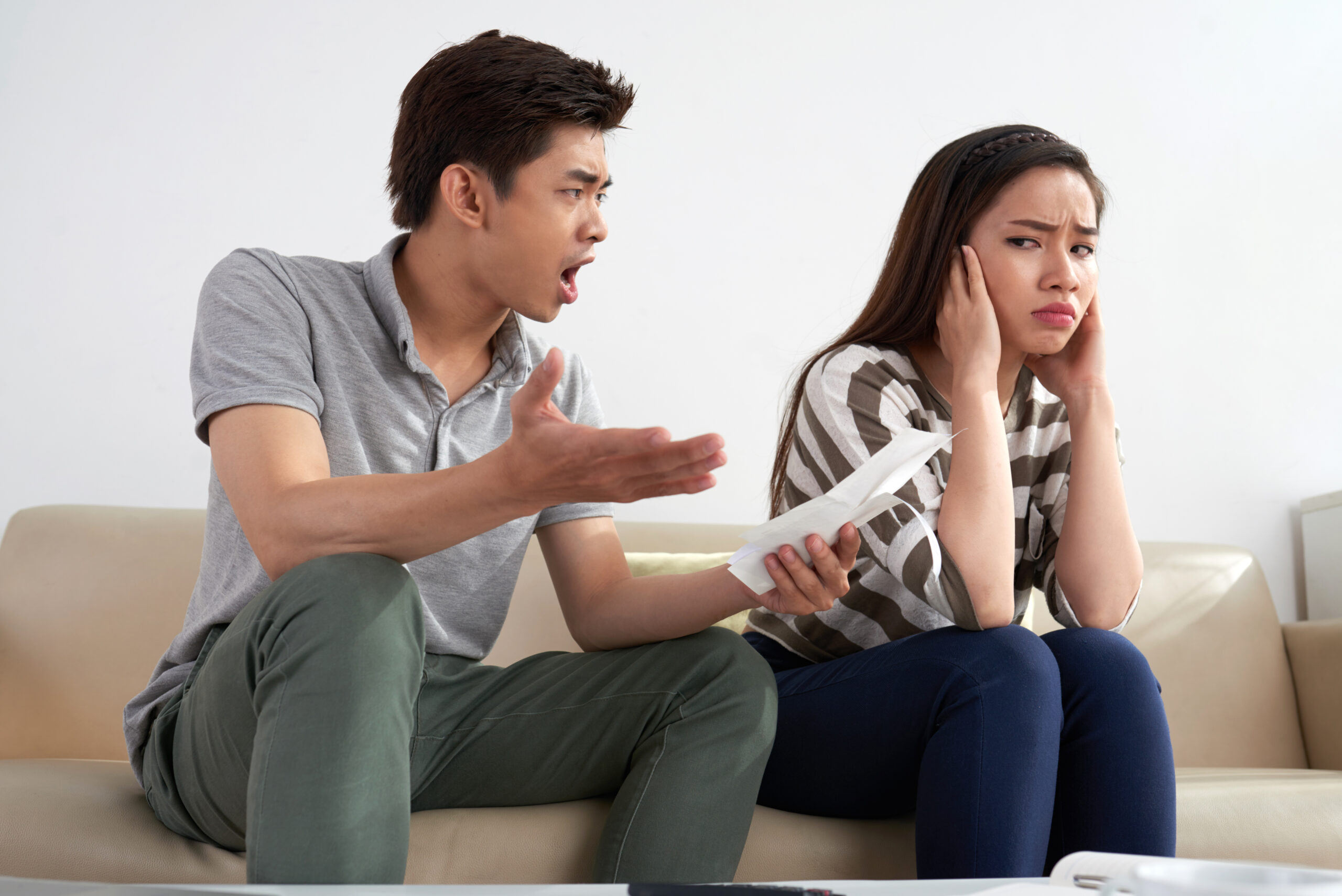 A couple experiencing communication problems during a heated discussion at home