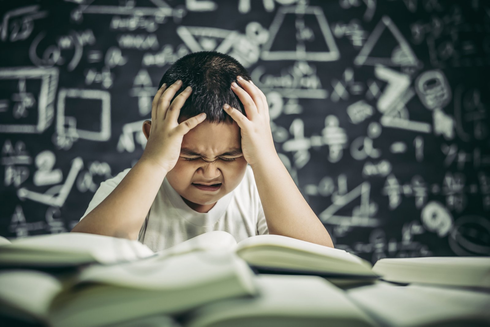 a student has a headache with his homework